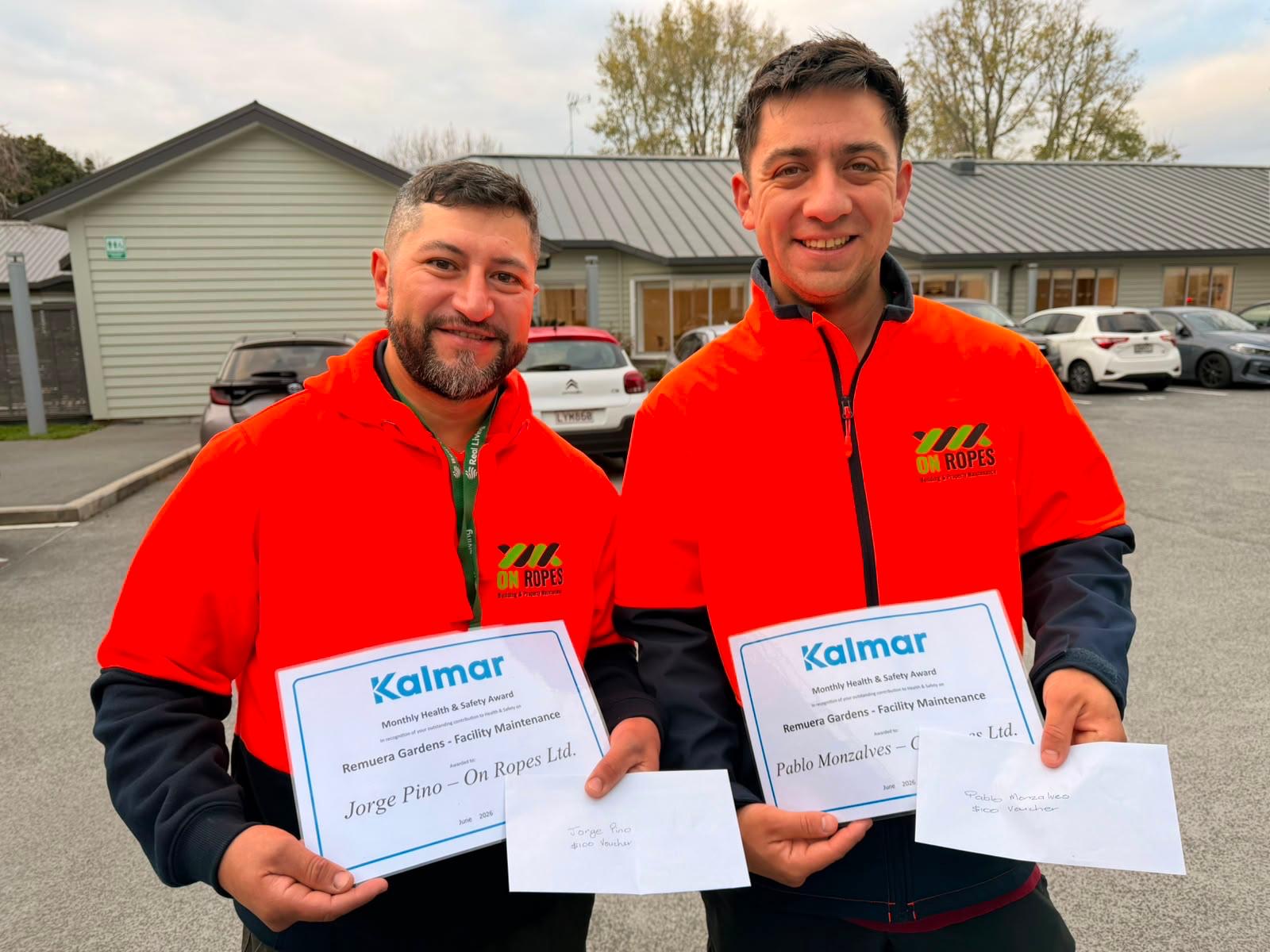 Jorge Pino and Pablo Monzalvez of On Ropes with their client health and safety awards for facility maintenance
